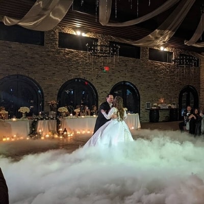 Couple dancing on what looks like clouds.